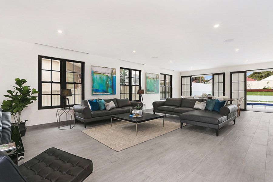 Open-plan living room with steel-framed windows