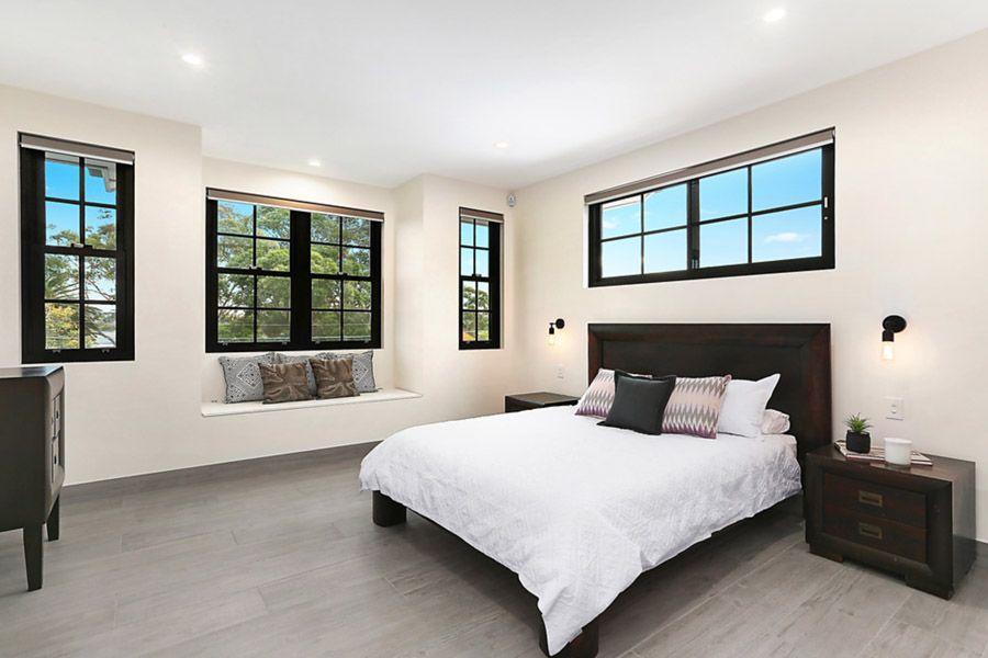 Bedroom with black-framed windows