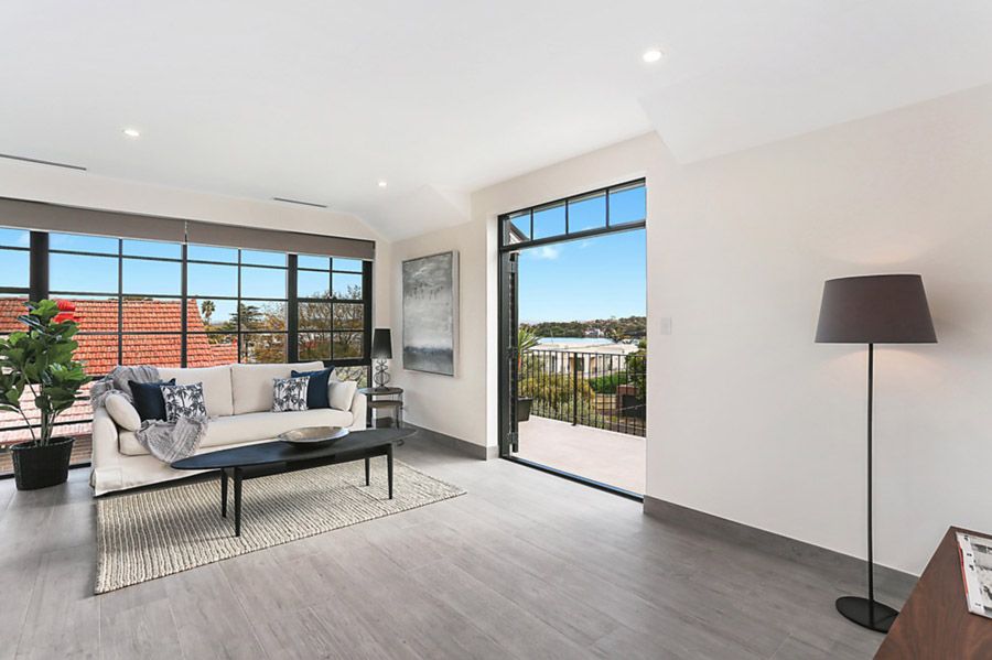 Living room opening to a balcony