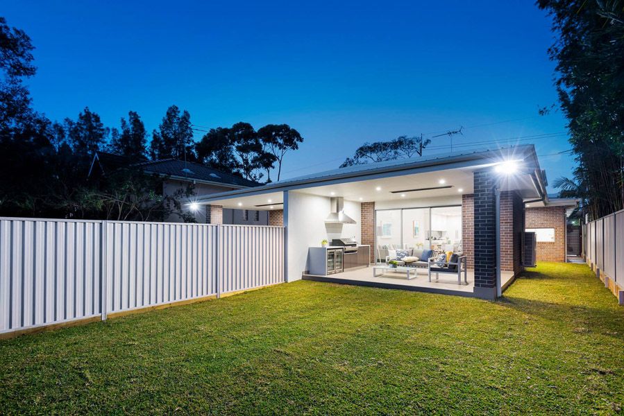 Rear lawn and granny flat at dusk