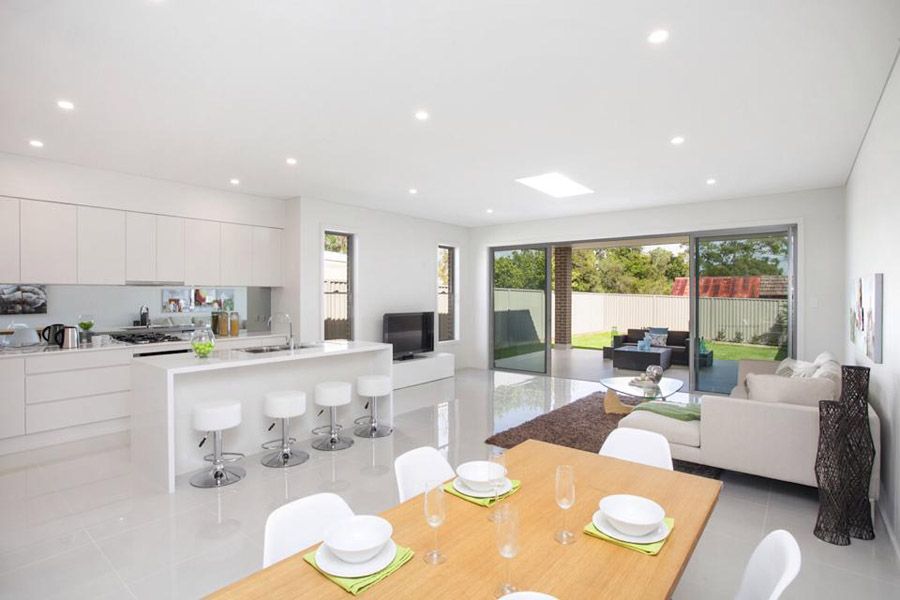 Open kitchen and dining with garden views